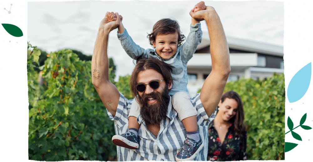 kid enjoying with his father and mother